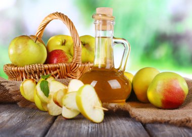 Apple cider vinegar and apples clipart