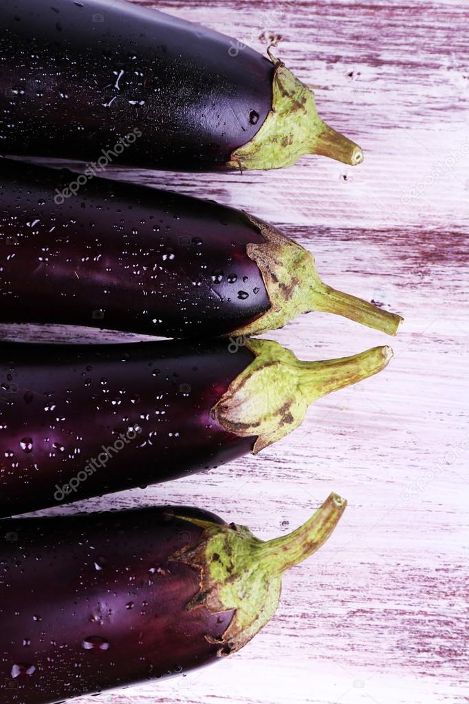 Aubergines on wooden background