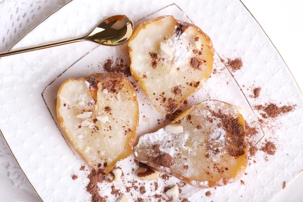 Baked pears with syrup on plate, on bright background — Stock Photo, Image