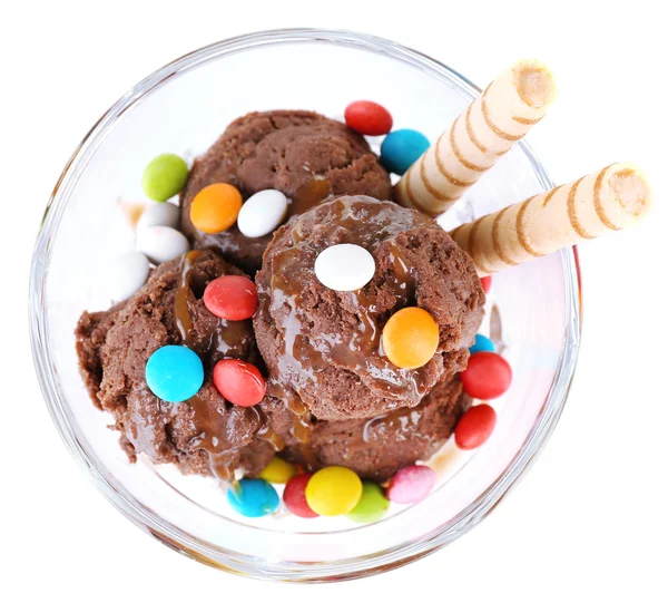 Chocolate ice cream with multicolor candies and wafer rolls in glass bowl, isolated on white — Stock Photo, Image