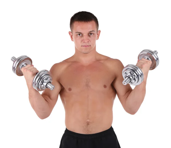 Handsome young muscular sportsman execute exercise with dumbbells isolated on white — Stock Photo, Image