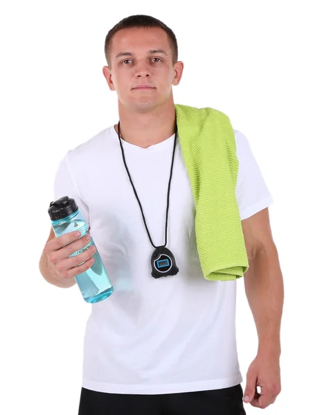 Handsome young sportsman holding towel and bottle with water isolated on white — Stock Photo, Image