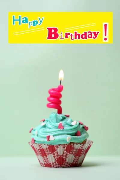 Delicious birthday cupcake on table on light background — Stock Photo, Image