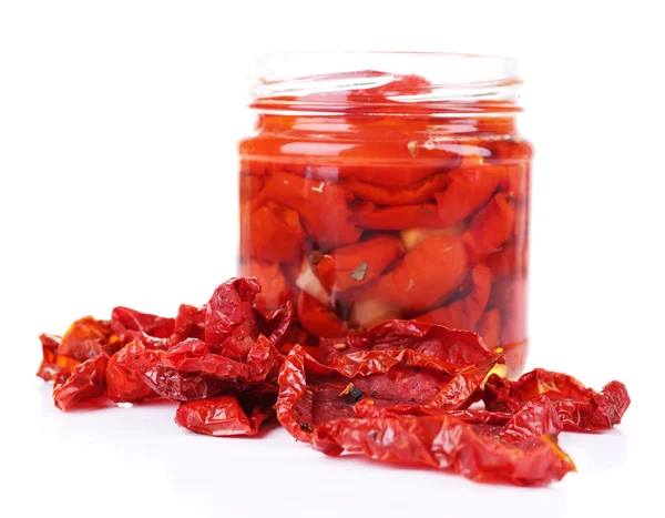 Sun dried tomatoes in glass jar isolated on white — Stock Photo, Image