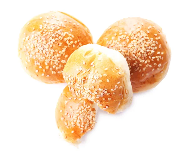 Tasty buns with sesame isolated on white — Stock Photo, Image