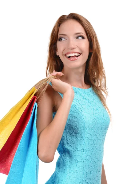 Hermosa mujer joven con bolsas de compras aisladas en blanco —  Fotos de Stock