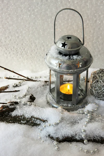 Metal flash light and Christmas decoration on light background — Stock Photo, Image