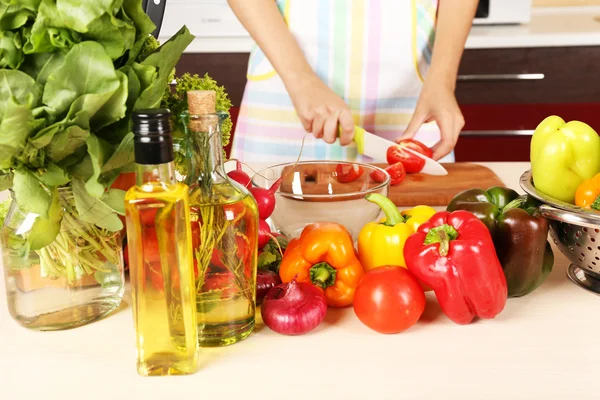 Woman cooking vegetable salad — Stock Photo, Image