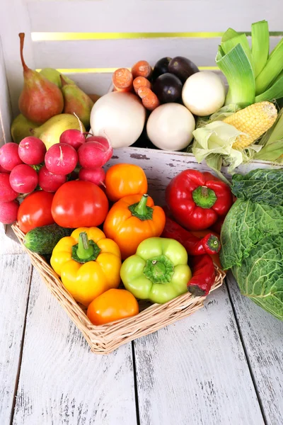 Vegetables in crate and in basket — Stock Photo, Image