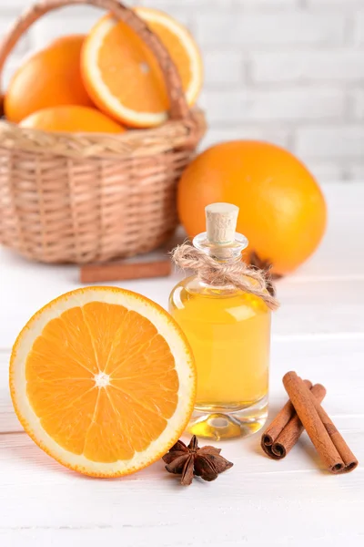 Tangerine oil on table on light background — Stock Photo, Image