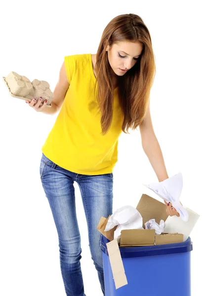 Young girl sorting paper and cardboard isolated on white — Stock Photo, Image