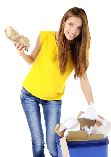 Young girl sorting paper and cardboard isolated on white — Stock Photo, Image