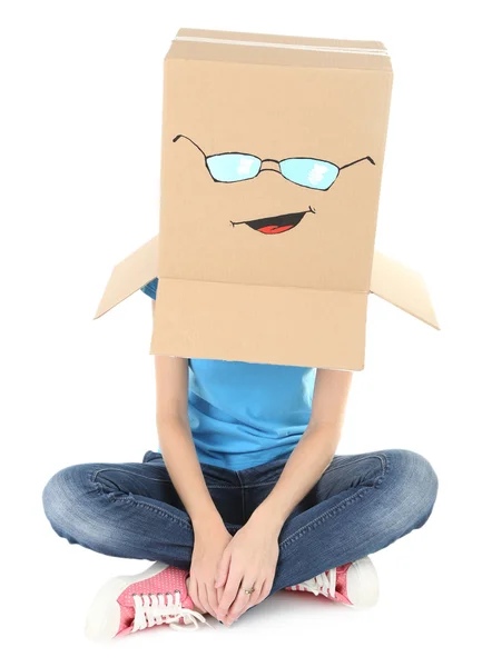 Woman with cardboard box on her head with happy face, isolated on white — Stock Photo, Image