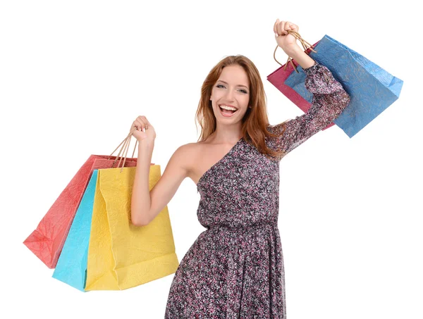 Beautiful young woman with shopping bags isolated on white Royalty Free Stock Photos