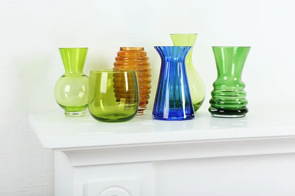 Colorful vases on white table — Stock Photo, Image