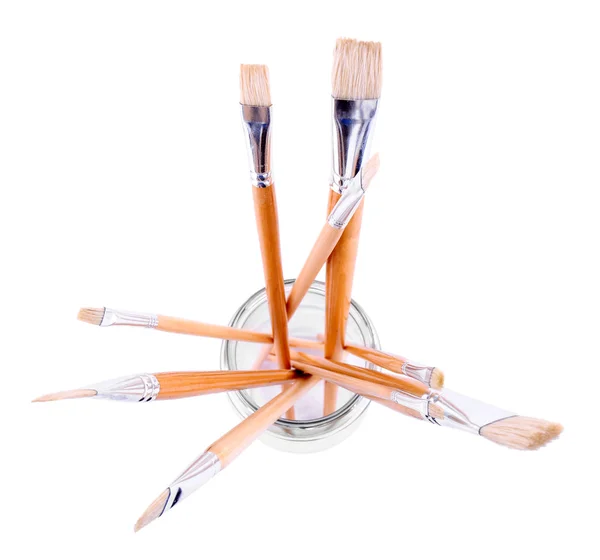 Paint brushes in glass jar — Stock Photo, Image