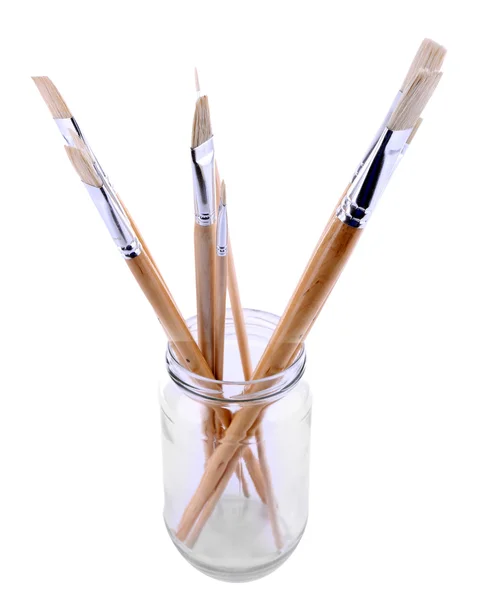 Paint brushes in glass jar — Stock Photo, Image