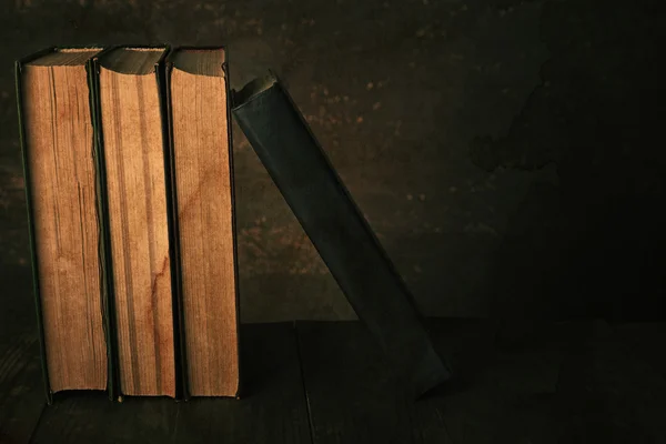 Antiquarian books on wooden table — Stock Photo, Image