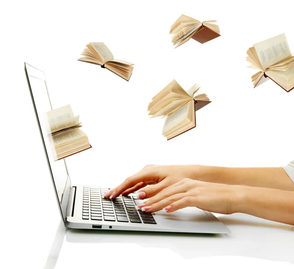 Books flying in laptop — Stock Photo, Image