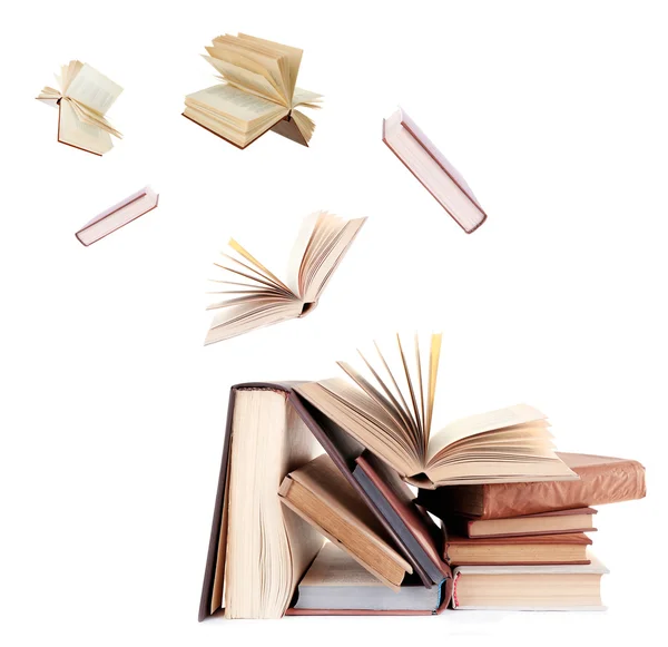 Fliegende Bücher auf weiß — Stockfoto