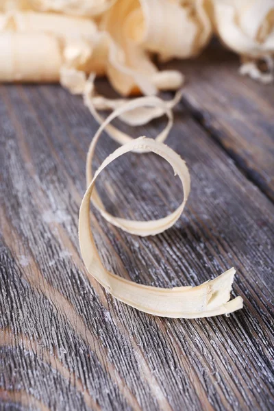 Wood shavings on grey — Stock Photo, Image