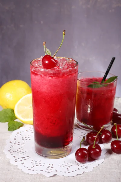 Fresh cold cherry cocktail with mint and lemon — Stock Photo, Image