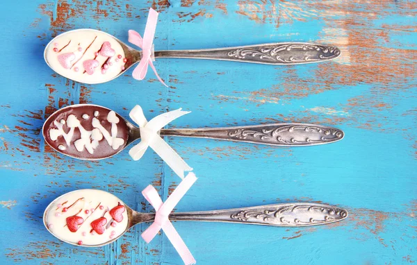 Spoons with tasty chocolate — Stock Photo, Image