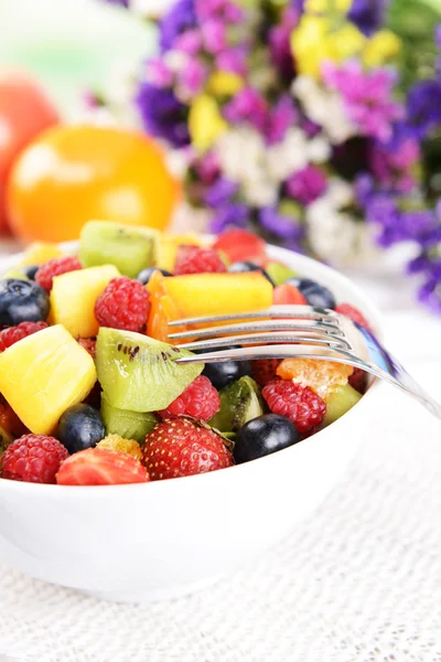 Delicious fruits salad in plate on table close-up — Stock Photo, Image