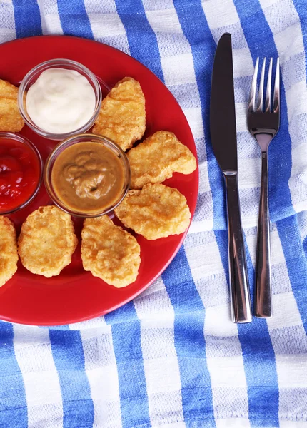 Chicken nuggets with sauces on table close-up — Stock Photo, Image