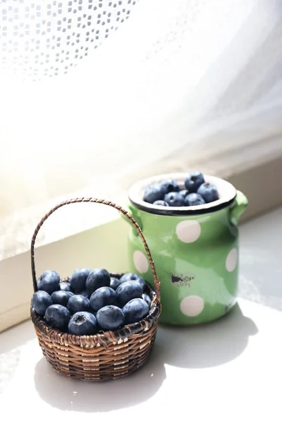 Fresh blueberries on window sill — Stock Photo, Image