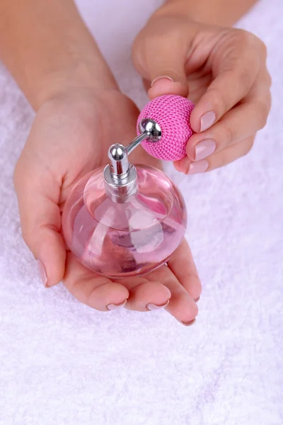 Woman hands holding perfume close up — Stock Photo, Image