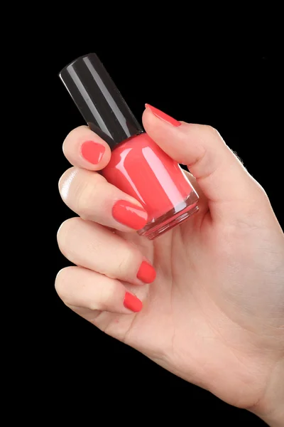 Nail polish in hand, close-up — Stock Photo, Image