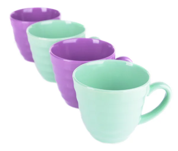 Яркие чашки на белом — стоковое фото