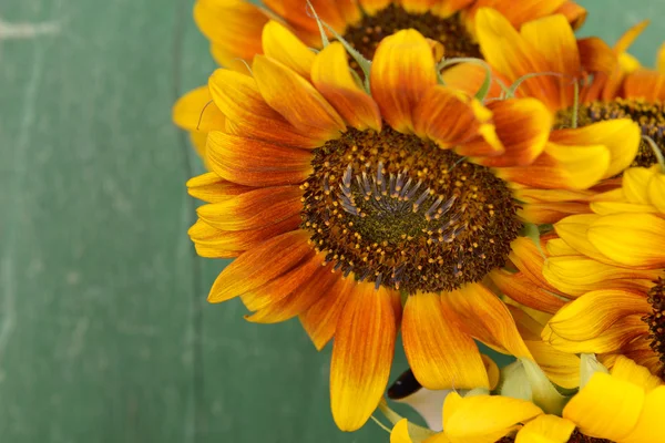 Beautiful sunflowers on wood — Stock Photo, Image