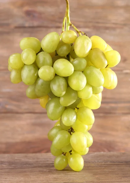 Bunch of grape on wooden background — Stock Photo, Image