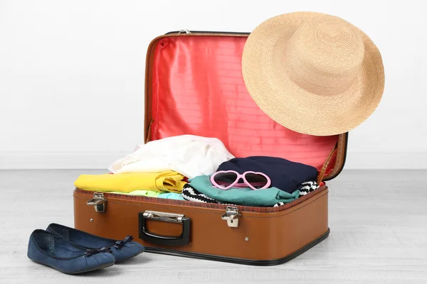 Female clothes in old suitcase — Stock Photo, Image