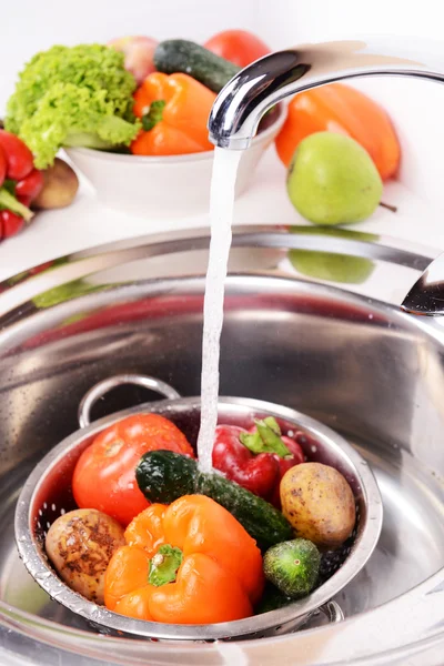 Washing fruits and vegetables close-up