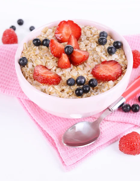 Tasty oatmeal with berries isolated on white — Stock Photo, Image