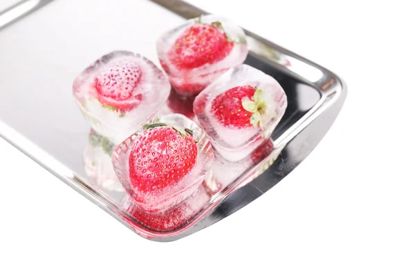 Ice cubes with strawberry on tray isolated on white — Stock Photo, Image