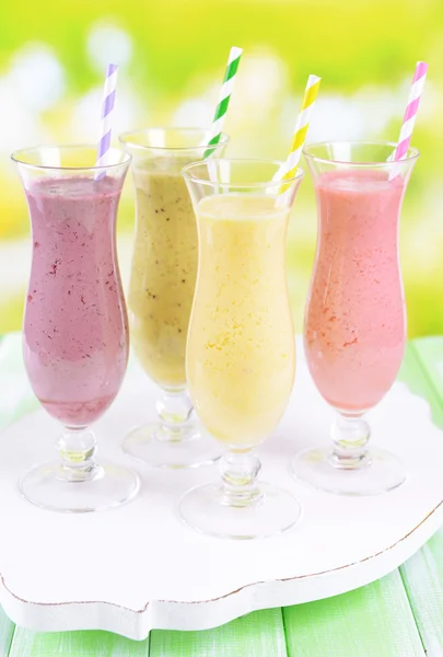 Delicious berry cocktails on table on bright background — Stock Photo, Image