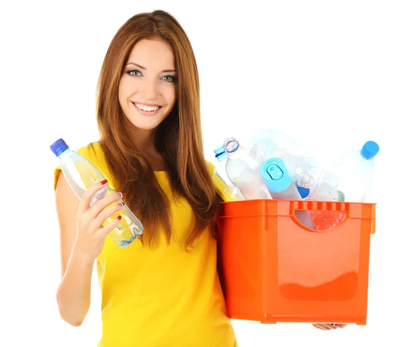 Young girl sorting plastic bottles isolated on white — Stock Photo, Image