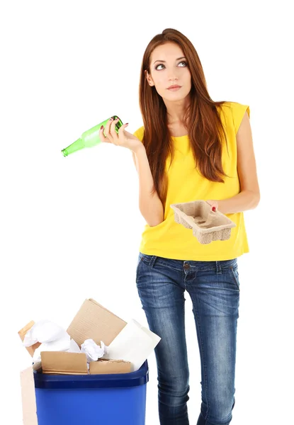 Young girl sorting paper and cardboard isolated on white — Stock Photo, Image