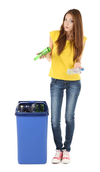 Young girl sorting glass bottles isolated on white — Stock Photo, Image