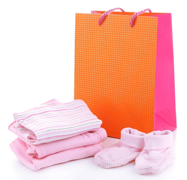 Baby clothes and gift bag isolated on white — Stock Photo, Image