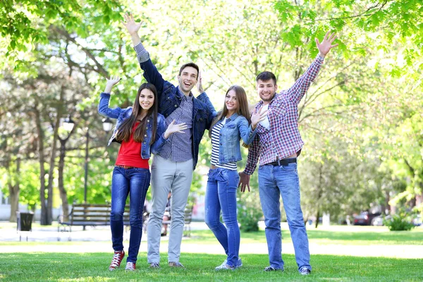 Happy students in park — Stock Photo, Image