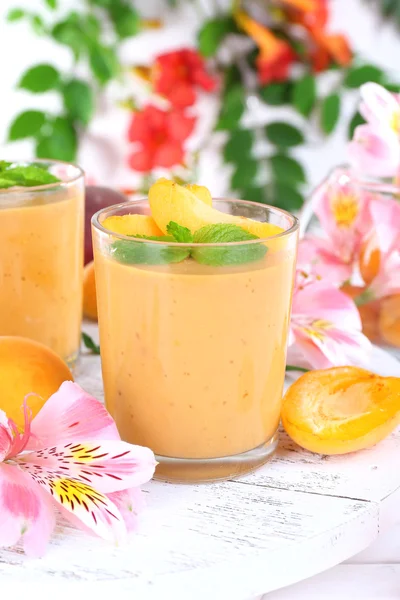 Apricot dessert in glasses on table close-up — Stock Photo, Image