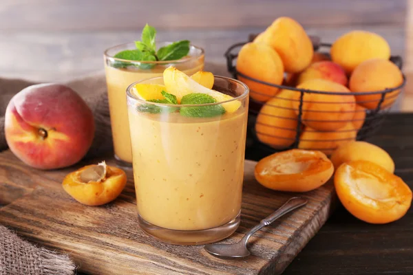 Apricot dessert in glasses on table close-up — Stock Photo, Image