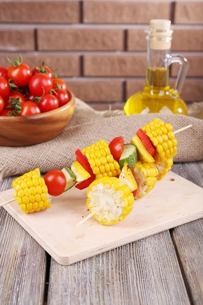 Sliced vegetables on picks on board on table close-up — Stock Photo, Image