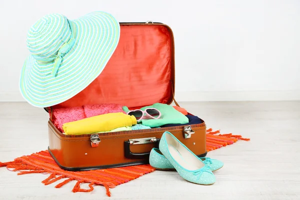 Female clothes in old suitcase — Stock Photo, Image