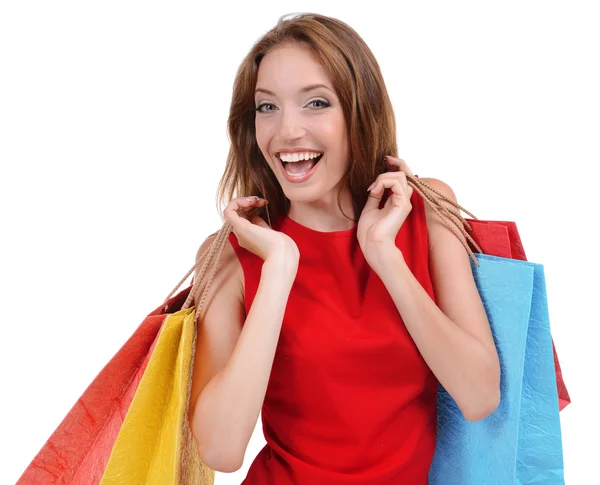Beautiful young woman with shopping bags isolated on white — Stock Photo, Image